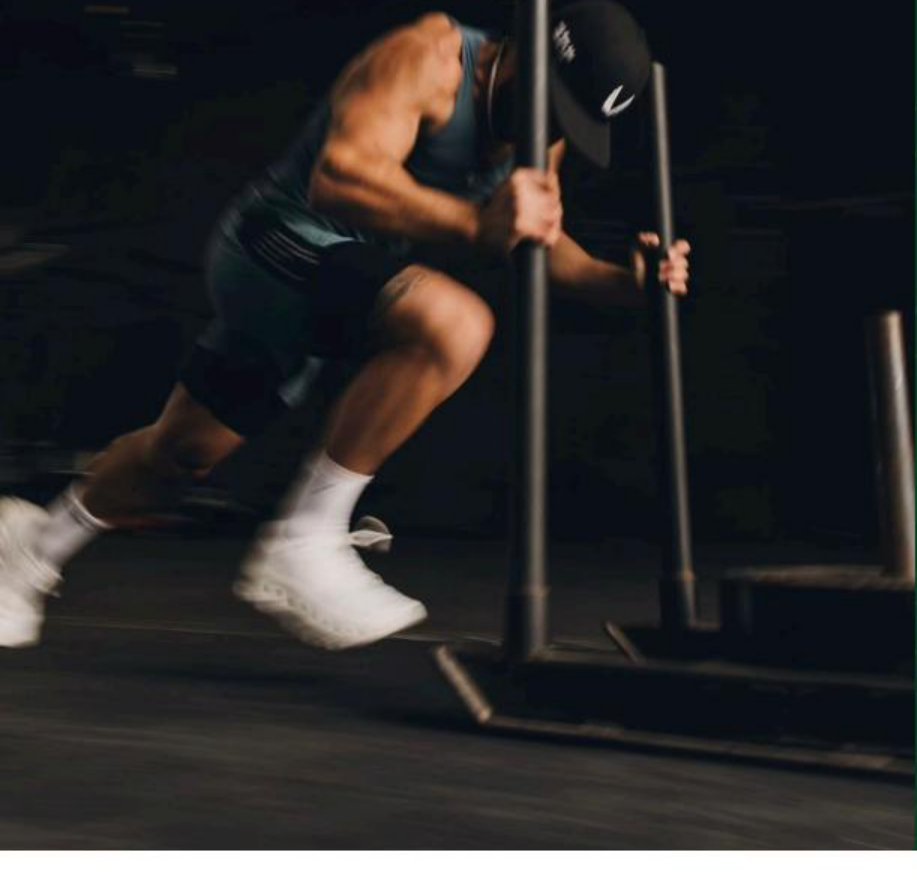Athlete pushing a sled with motion blur